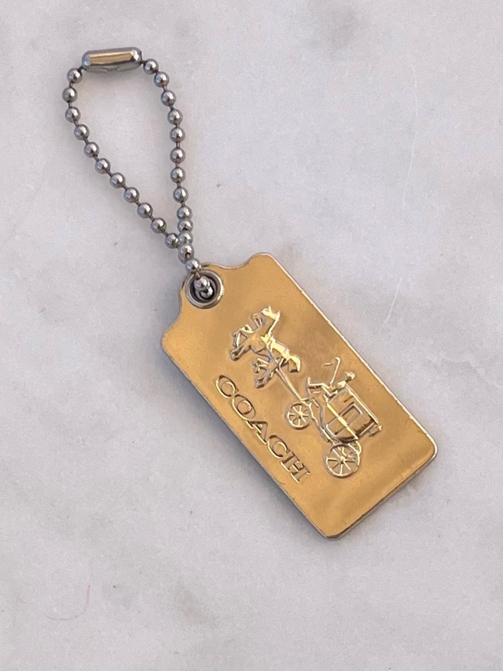COACH Metal Horse & Carriage Hang Tag, Gold